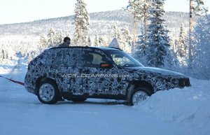 bmw-x1-prototype-stuck-in-snow-bank.jpg